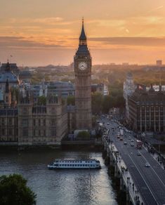 the big ben clock tower towering over the city of london, england at sunset or dawn