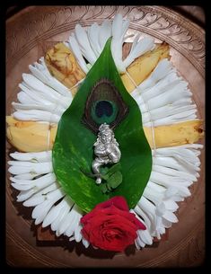 a plate that has some food on it and a flower in the middle of it