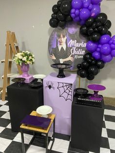 purple and black balloons are on display at the event