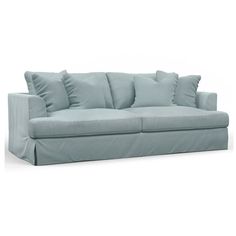 a light blue couch with several pillows on the arm and back cushions, in front of a white background