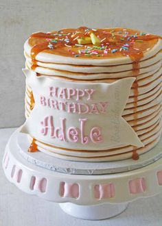 a birthday cake with frosting and sprinkles on it that says happy birthday able