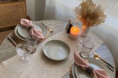 the table is set with place settings for four