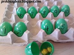 an egg carton filled with green eggs and numbers