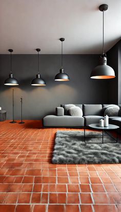 a living room filled with lots of furniture and lamps hanging from the ceiling above it