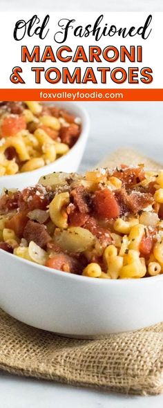 two white bowls filled with macaroni and tomatoes on top of a burloom cloth