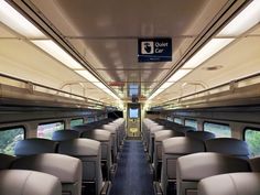 an empty train car with seats and windows