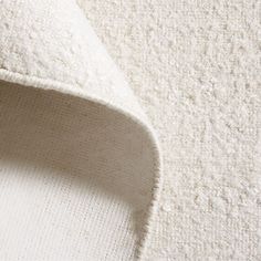 a close up view of a white fabric