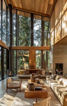 a large living room with high ceilings and lots of windows on the side of it