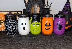 halloween mason jars lined up on a table