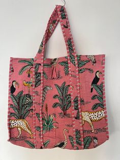 "Here's your all season Long tote bag. Beautifully Cotton fabric with Tiger pattern and padded Quilted Work very delicate and feminine look. Fabric is traditionally hand block printed in Tiger Prints  . We work with a small and family owned block print fabric makers and sewers to make these Long tote bags. Item :- Cotton Handbag Material: 100% Cotton Color - Salmon Pink  Pattern: Quilted Bag Style: Tote Bag Size in Inch:- Length - 19\" inch Width - 25\" inch Handle - 11\" inch Product Work: Printed & quilted Stitched Usage : Perfect for Plastic Bag substitute. Can carry up to two wine bottles or about 3 bananas, 1 papaya, 4 avocados and 1 watermelon.  Make a good Sustainable Gift . Perfect for beach, city stroll or to go to the market! Easily foldable, light weigh - ideal to keep in your t Casual Reversible Rectangular Beach Bag, Summer Reversible Rectangular Bag, Pink Reversible Shoulder Bag For Daily Use, Pink Reversible Rectangular Shoulder Bag, Pink Rectangular Reversible Shoulder Bag, Pink Reversible Shoulder Bag For Shopping, Pink Reversible Shopping Bag, Leopard Print Rectangular Shopping Bag, Rectangular Cotton Bag With Cat Print