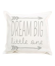 a white pillow with the words dream big little one printed on it and an arrow