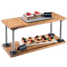 two tiered serving trays with food on them, one is made out of wood and the other has metal legs