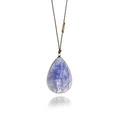 Artist Margaret Solow has combined a faceted teardrop shaped tanzanite with a 14k yellow gold bezel for a casually elegant look that is as versatile as it is beautiful. Hanging lightly from an 18" brown nylon cord with a 14k yellow gold lobster clasp, this necklace features three 18k gold faceted accent beads for a bit of sparkle. Stone measures about 1" x 11/16". Handcrafted in Los Angeles, CA, U.S. Tanzanite Necklace, Casually Elegant, Rose Cut, Lobster Clasp, 18k Gold, Handmade Jewelry, White Gold, Sparkle, Angeles