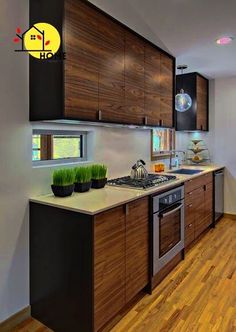 a kitchen with wooden cabinets and stainless steel appliances