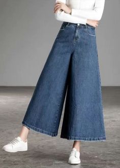 Solid Color High Rise Baggy Bottoms, Casual High Waist Baggy Culottes, Baggy High-rise Solid Bottoms, Wide Leg Stretch Skirt, Stretch Wide Leg Skirt, Baggy Culottes With Pockets, Baggy High-waist Culottes With Pockets, Spring Hip-length Bottoms, Casual High Waist Stretch Culottes