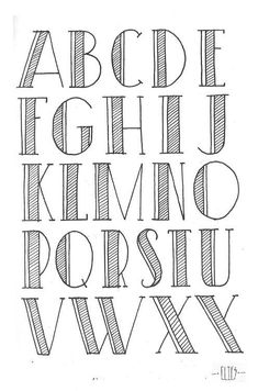 the alphabet is drawn in pencil on paper