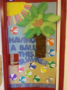 a bulletin board with a palm tree in the middle and words on it that say having a ball this summer