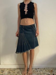 Super hot Plein Sud Jeans denim skirt.  Such Y2K fabulousness! Great asymmetric shape to the skirt - I think the way to put it on is to put the Plein Sud label in the back - or maybe you can wear it however you like! Low waist.  Super cute multi pleated detail at the side, makes a flirty side tail of sorts.  Metal zipper fly with Plein Sud logo button at the waist.  Front hip pockets.  One back patch pocket.  Frayed raw hem edge.  Cotton denim in a faded blue jeans.  Label Plein Sud Jeans. Size 38/ 6. 100% cotton. Please wash cool delicate, drip dry.  Very good vintage condition with no fabric or sewing flaws.  Measurements Low Waist 80cm/ 31.5inches Hips 96cm/ 37.5inches Waist to hem 50cm/ 20inches Models measurements Shoulders 40cm/ 15.7inches Chest 83cm/ 33inches Waist 68cm/ 27inches Hi Low Waisted Skirt, Asymmetrical Mini Skirt, Jeans Label, Faded Blue Jeans, Pleated Denim Skirt, Cotton Gauze Dress, Y2k Mini Skirt, Vintage Denim Skirt, Denim Trench Coat