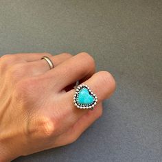 "ArtisanLab Jewelry Kingman Turquoise Mini Heart Stacking Ring Material: Sterling silver +Kingman Turquoise ♥Ready to ship: Size -US5.5 ♥Made to order- 7 days to make (Please leave your ring size on \"Note\" at checkout) ♥Email (artisanlabjewelry@gmail.com) or DM (instagram: artisanlab) me if you want to choose your stones ♥ Made in my home studio from Austin Texas, using time-consuming, traditional metalsmithing techniques. This piece is made with solid craftsmanship and all parts of this piece have been hand-fabricated. ♥ All of the pieces in my collections are handmade and hand-finished." Handmade Blue Heart Ring, Handmade Blue Heart Shaped Ring, Heart-shaped Turquoise Ring For Anniversary, Turquoise Gemstone Heart Ring For Anniversary, Heart-shaped Turquoise Ring As Gift, Heart-shaped Blue Turquoise Ring Gift, Heart-shaped Blue Turquoise Ring For Gift, Heart-shaped Turquoise Blue Ring For Gift, One Of A Kind Turquoise Heart Jewelry