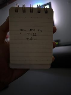 a notepad with the words you are my wish on it is held in someone's hand