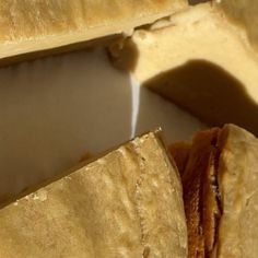 a close up view of some food on a plate with water coming out of it