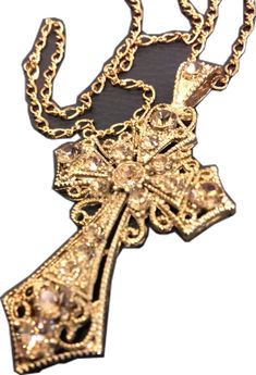 Gold Cross Pendant Jewelry For Party, Gold Cross Necklace For Party, Adjustable Gold Cross Pendant Necklace, Spiritual Gold Cross Necklace, Gold Spiritual Cross Pendant Necklace, Gold Metal Crucifix Cross Necklace, Gold Bling Cross Pendant Necklace, Gold Rhinestone Cross Necklace, Elegant Gold Metal Cross Necklace