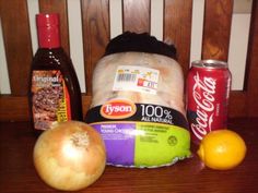 an assortment of food sitting on top of a wooden table next to two oranges