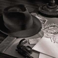 an assortment of hats and papers on a table