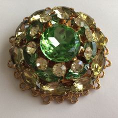 Amazing vintage mid century collectible brooch.Piece contains sparkling citrine, topaz, and peridot rhinestone in gold tone setting. Made in 1960's in West Germany. Excellent Vintage Condition. 1928 Jewelry, West Germany, Cat Pin, Citrine, Beautiful Necklaces, Brooch Pin, Topaz, Gold Tones, Etsy Gift Card