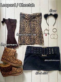 the contents of a leopard print top, skirt and shoes are laid out next to each other