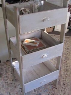 a white shelf with books on top of it