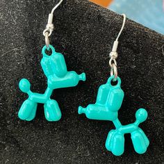 Cute Turquoise Colored Balloon Dogs On 925 Sterling Silver Wires. Trendy Blue Sterling Silver Jewelry, Playful Silver Drop Earrings, Playful Handmade Turquoise Jewelry, Playful Blue Nickel-free Jewelry, Fun Handmade Blue Jewelry, Fun Adjustable Turquoise Jewelry, Blue Hypoallergenic Fun Jewelry, Trendy Blue Sterling Silver Earrings, Fun Blue Nickel-free Earrings