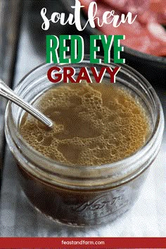 a jar filled with red eye gravy on top of a table