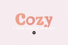 the word cozy is written in pink and black on a light pink background with tiny dots