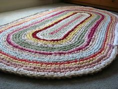 a multicolored round rug on the floor