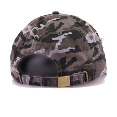 a camo cap with a black leather buckle on the front and gold metal bar at the peak