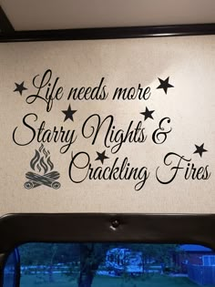 a sign that says life needs more starr nights and crackling fires on the wall