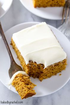 a piece of carrot cake on a plate with a fork