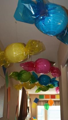 some balloons are hanging from the ceiling