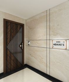 the entrance to an office building with a wooden door and nameplates on the wall