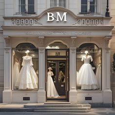 a store front with mannequins and dresses on display