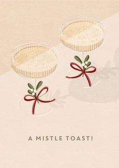 two desserts with bows on them sitting in front of the words, a mistle toast