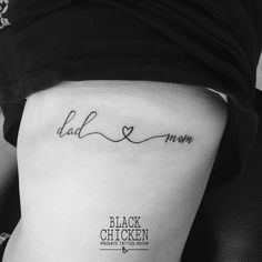 a woman's lower thigh with the word dad and mom written on her side