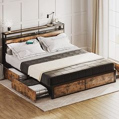 a bed with two drawers underneath it in a room next to a window and wooden floor