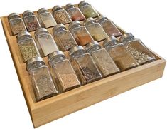 a wooden spice rack filled with lots of different kinds of spices