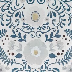 a white and blue floral design on the wall