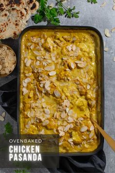 Pasanda curry in a black baking dish surrounded by flatbread, flaked almonds and coriander leaves. Mild Curry, Easy Oven Baked Chicken, Indian Dinner Recipes, Curry Recipes Easy, Yogurt Chicken, Premium Spices, Curry Recipes Indian, Easy Asian Recipes