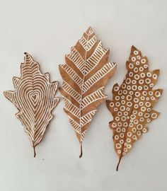 three wooden leaves are shown on the screen, one is brown and one is white