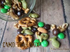 a glass jar filled with assorted nuts and pretzels