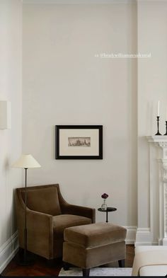 a living room filled with furniture and a fire place next to a wall mounted fireplace